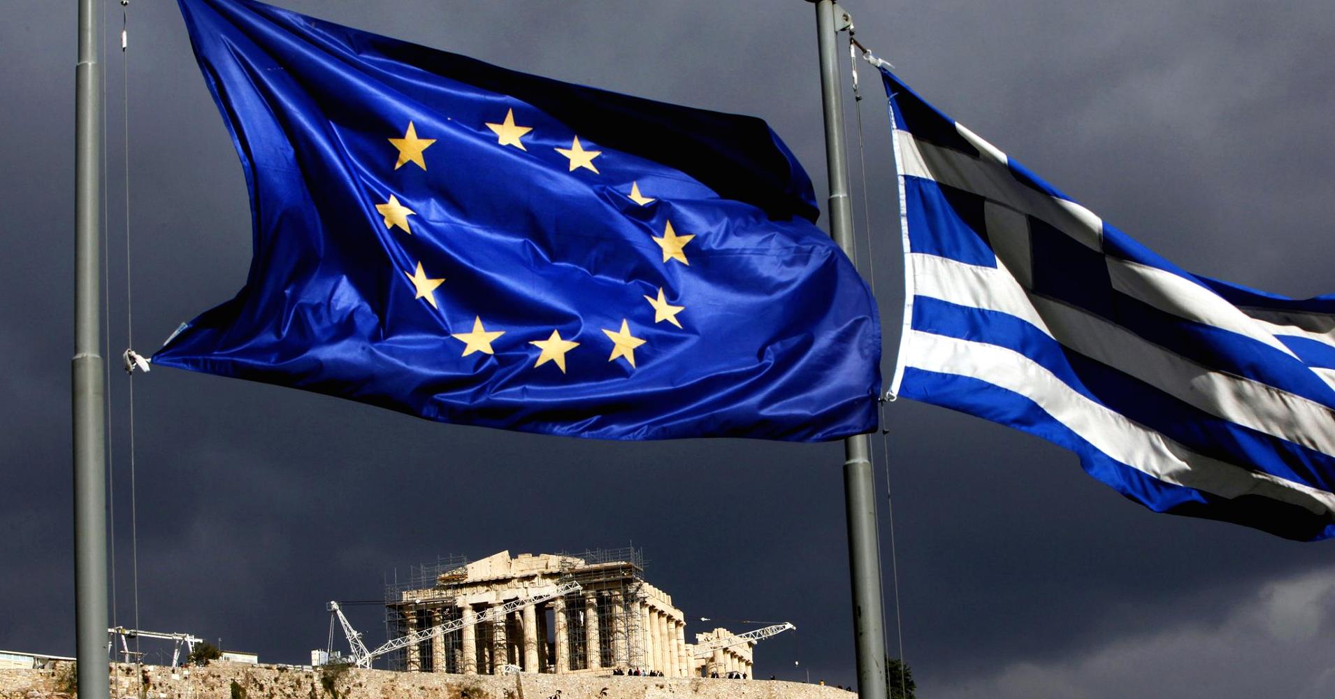 Angelos Tzortzinis | Bloomberg via Getty Images A European Union flag, left, and Greek national flag fly near the Parthenon temple on Acropolis hill in Athens, Greece.